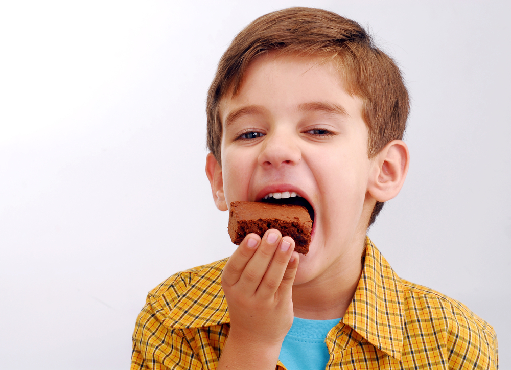 halloween kid eating a brownie